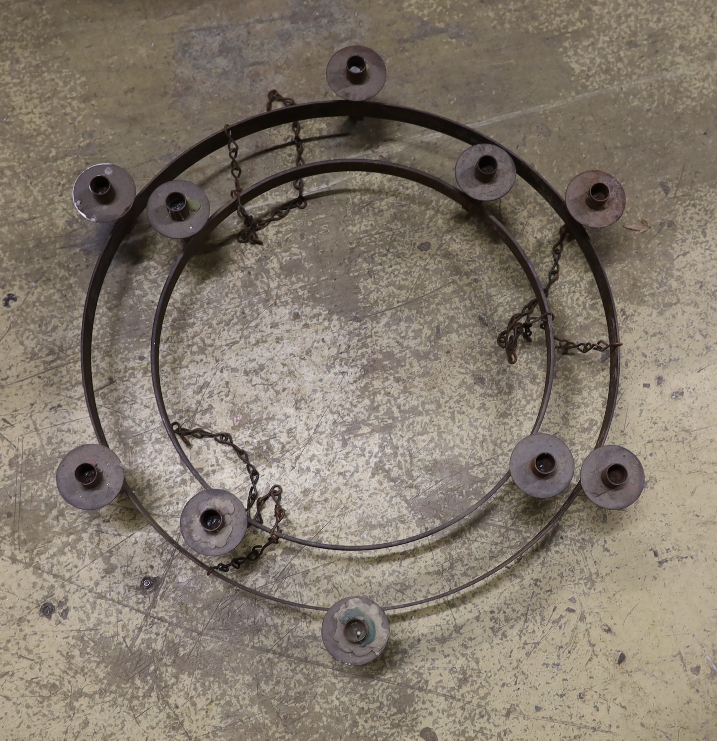 A wrought iron circular two tier hanging candle holder, diameter 76cm